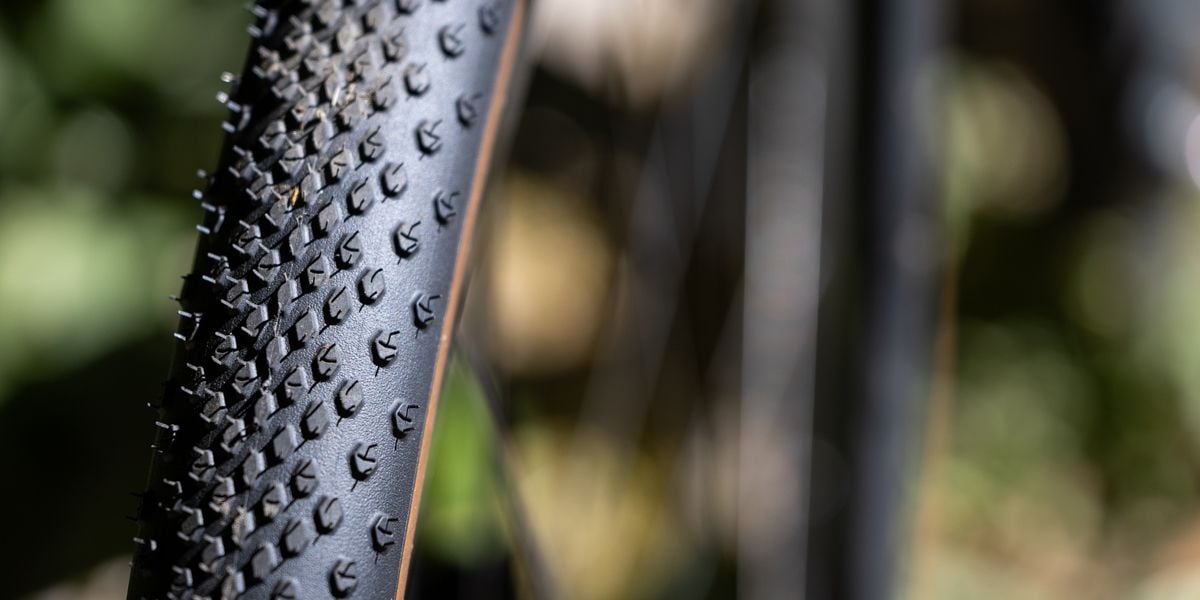 Bicycle tire on gravel road.