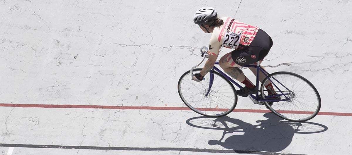 Cyclist riding on velodrome