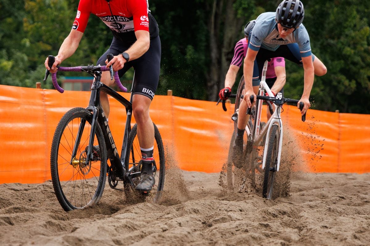 A rider crashing harmlessly in the sand