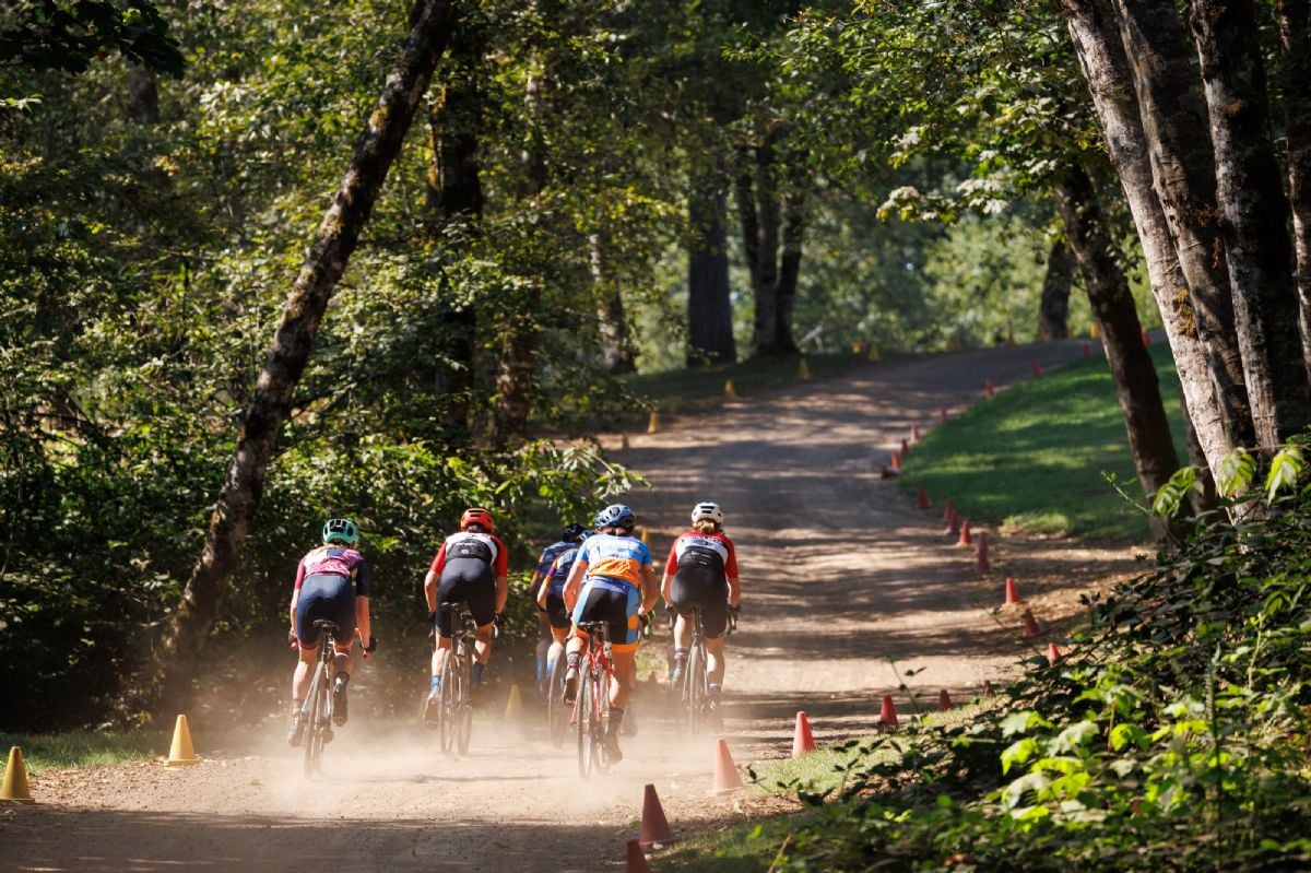 A group of riders competing be first into the first corner of the race