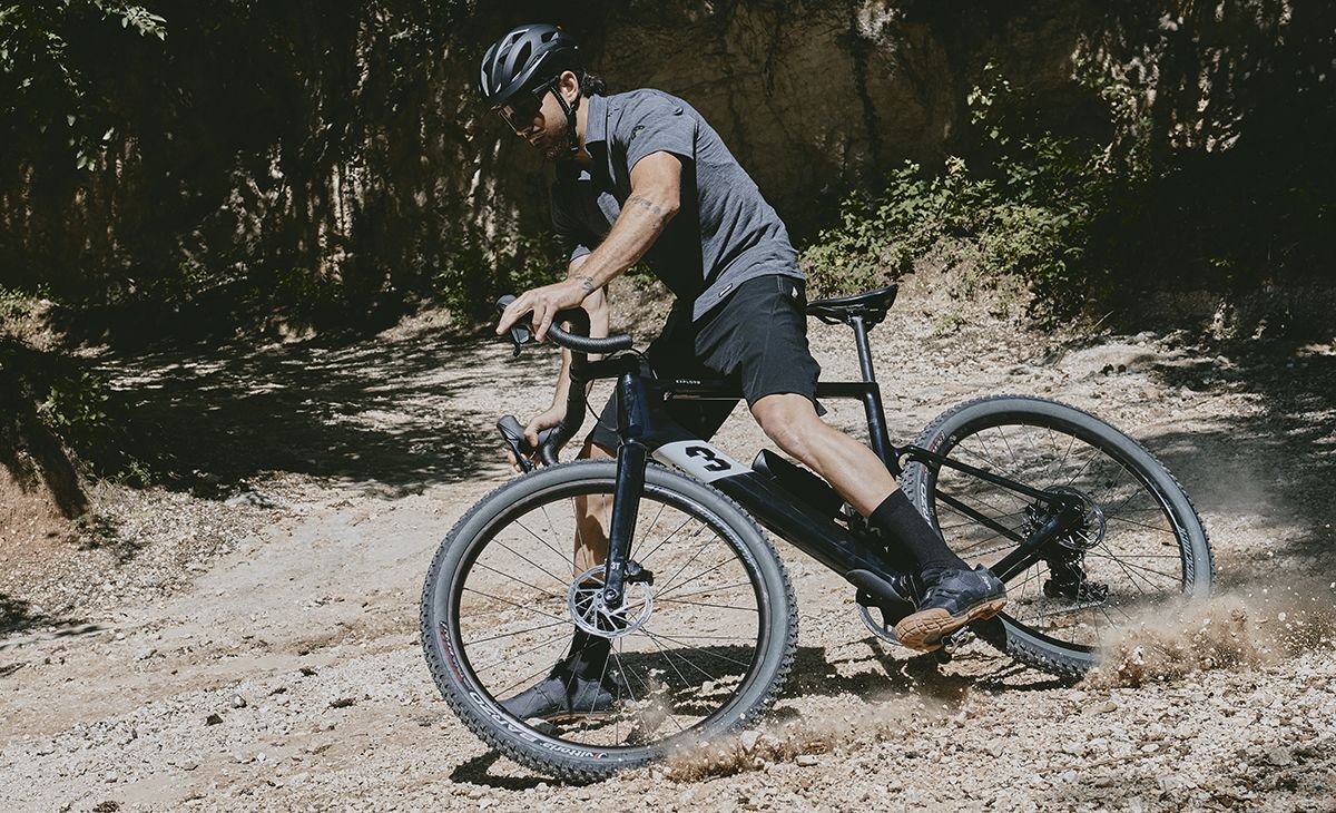 Cyclist getting rad on gravel road