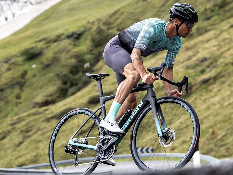 Cyclist riding Bianchi Specialissima