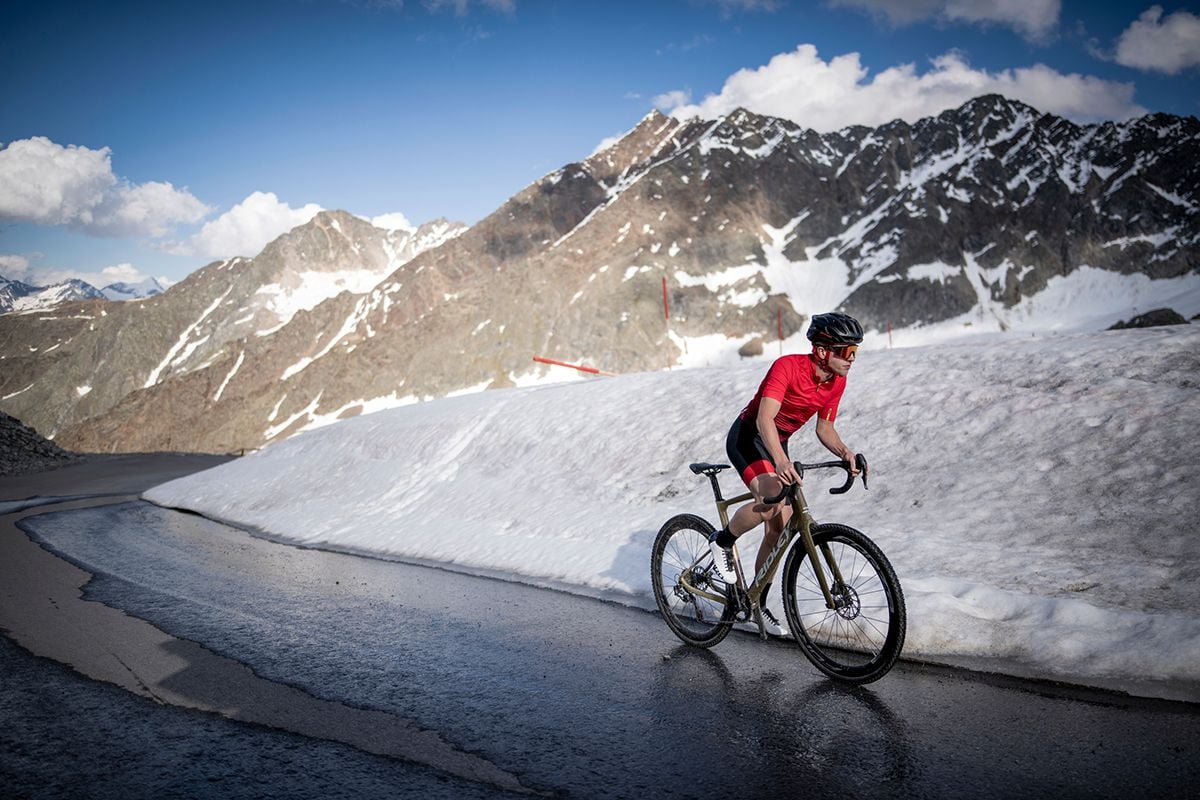 Cyclist riding up a mountain pass